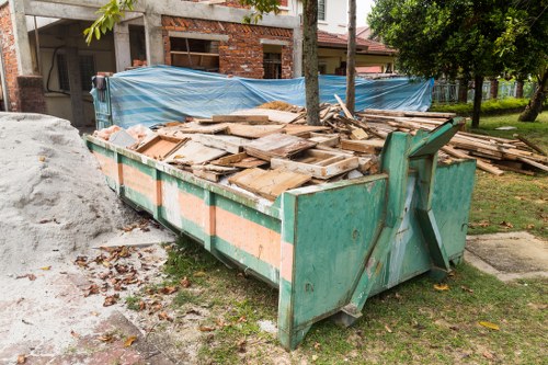 Various furniture pieces ready for disposal in Highgate